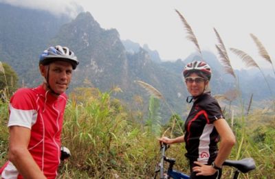John and Steph MacDonald Cycling on the  tour with redspokes